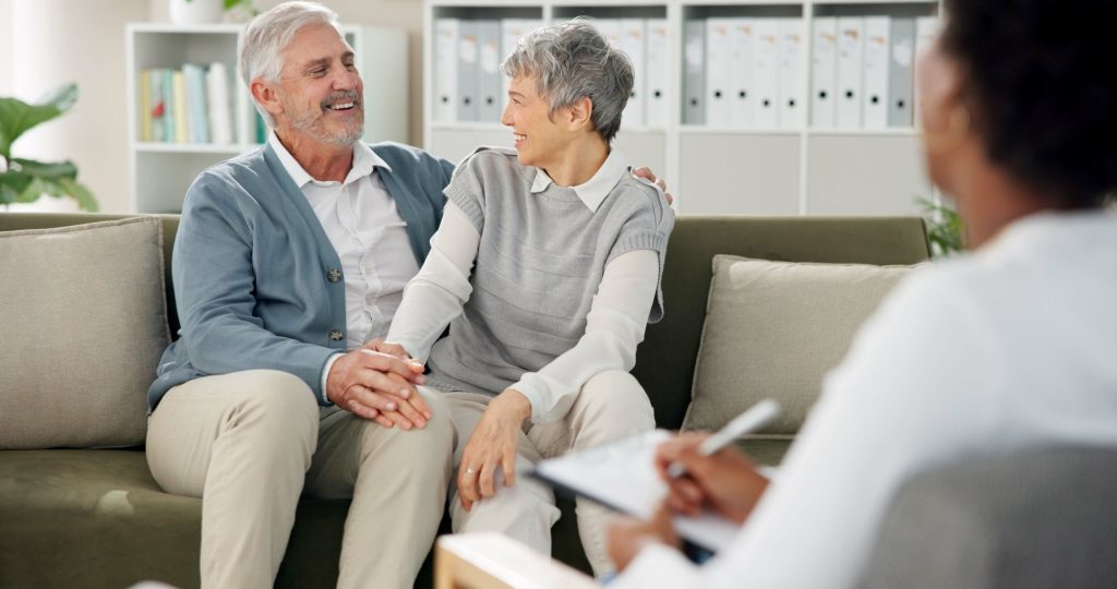 Older Couple Smiling Together in a Therapy Session