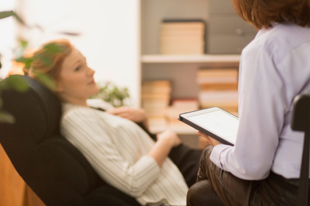 Psychiatrist interviewing patient